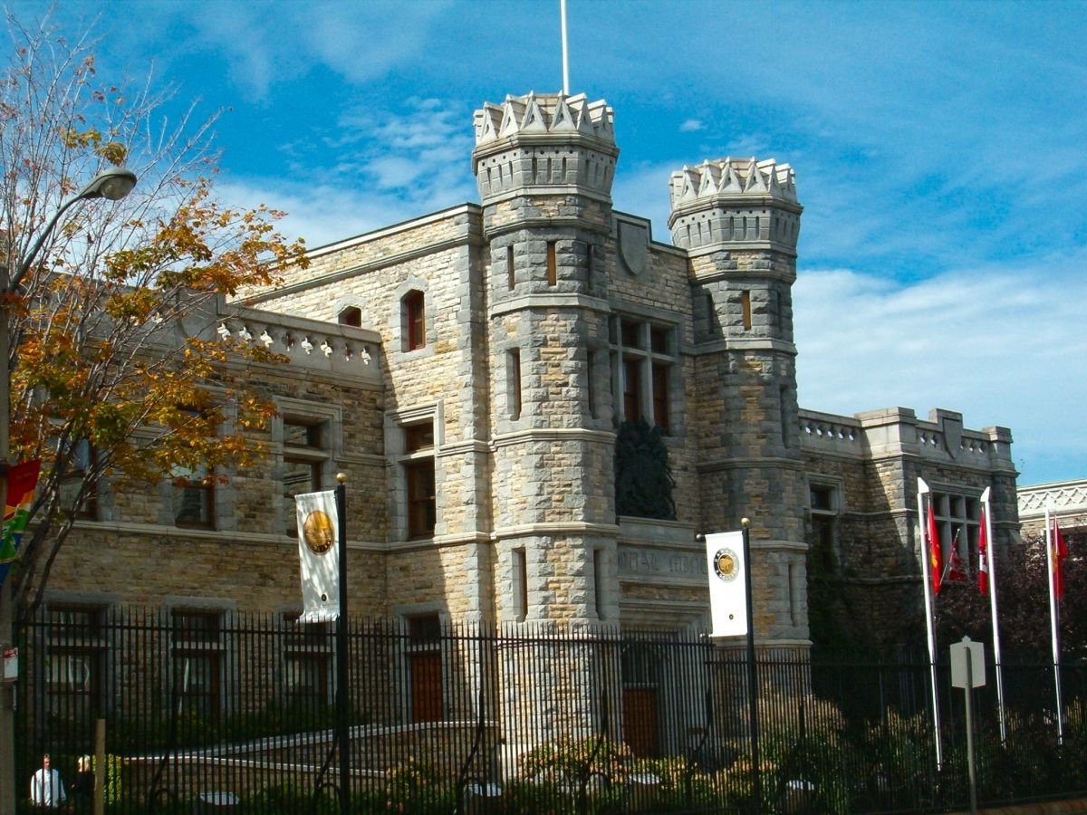 Exterior view of the stone building built in 1908. Resembling a castle, if features two small turrets on each of the main entrance.